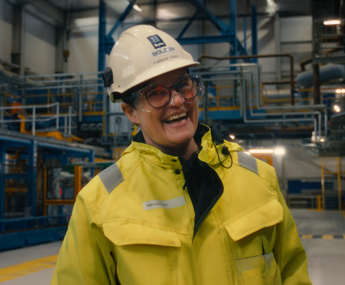 Lady in protective gear smiles